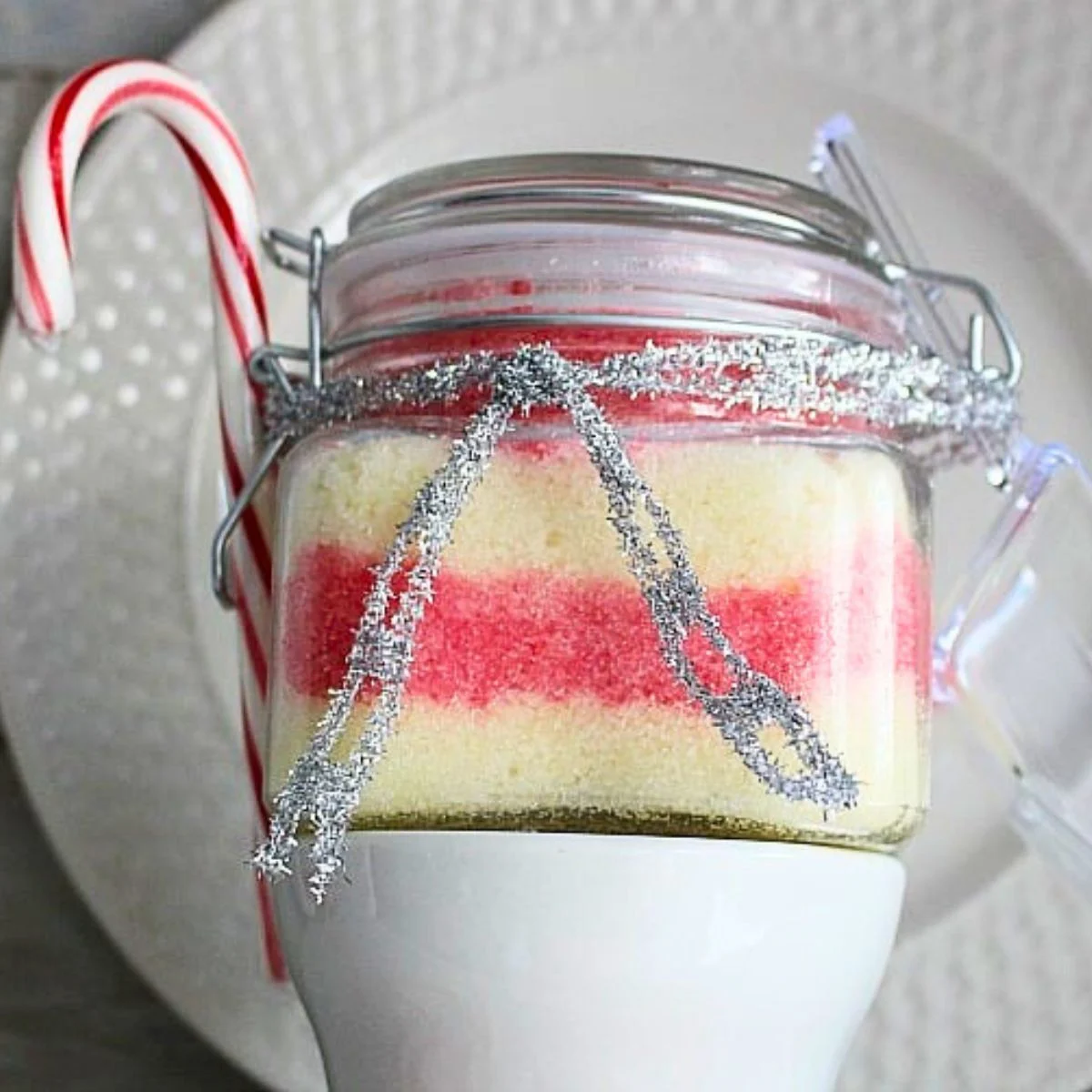 Homemade Peppermint Sugar Scrub with scoop and candy cane