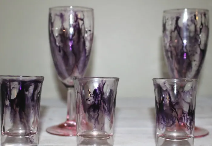How To Make Pretty Wine Glasses With Alcohol Ink Our Crafty Mom #wineglasses #alcoholink #shotglasses #crafts #pinterestchallenge