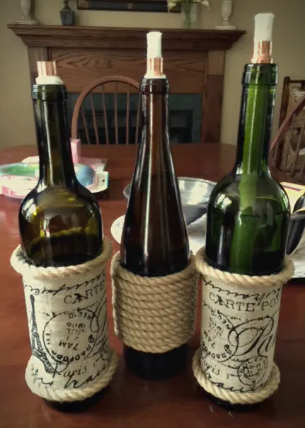 How To Make DIY Wine Bottle Tiki Torches And Solar Lights Our Crafty Mom #farmhousehens #winebottlecrafts #repurposed #tikitorches #solarlights