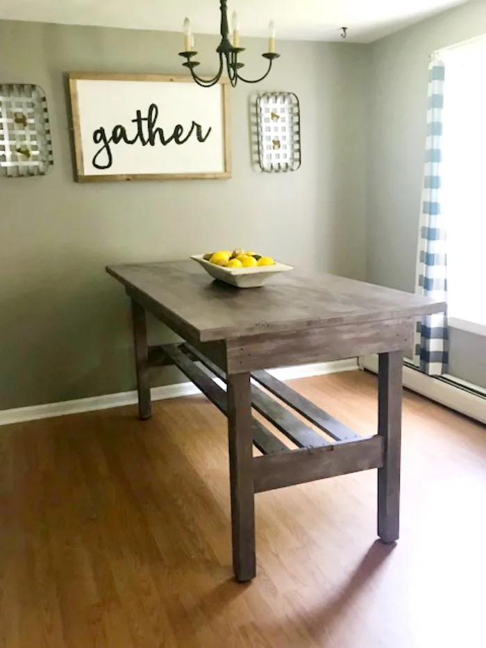 Create a large farmhouse dining table that seats 8 comfortably with a little love and paint Our Crafty Mom #farmhousetable