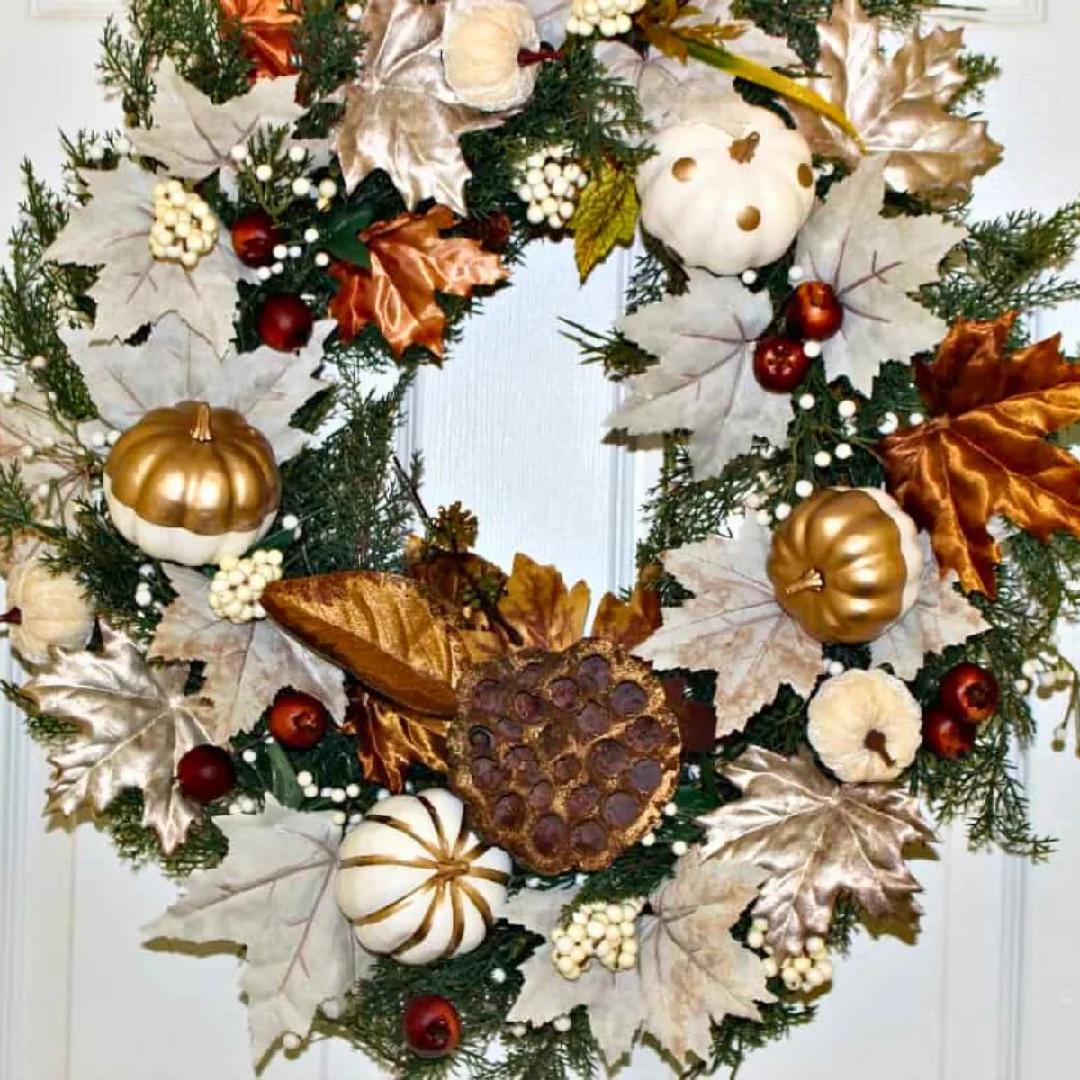 fall wreath in copper metallics in white on front door