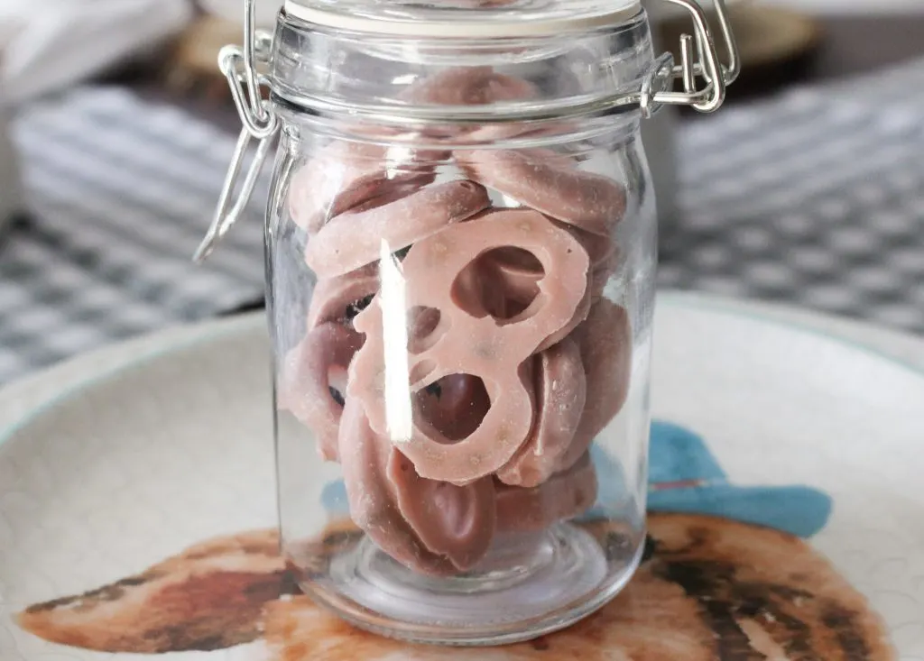 strawberry covered pretzels in glass jars Our Crafty Mom