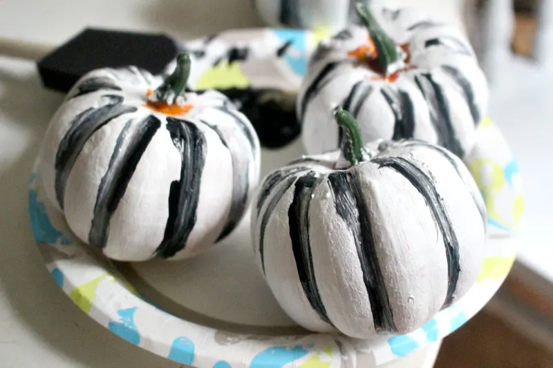 dollar store white pumpkins with black paint