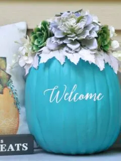 Teal Pumpkin Project succulent pumpkin on porch with pillow and small truck