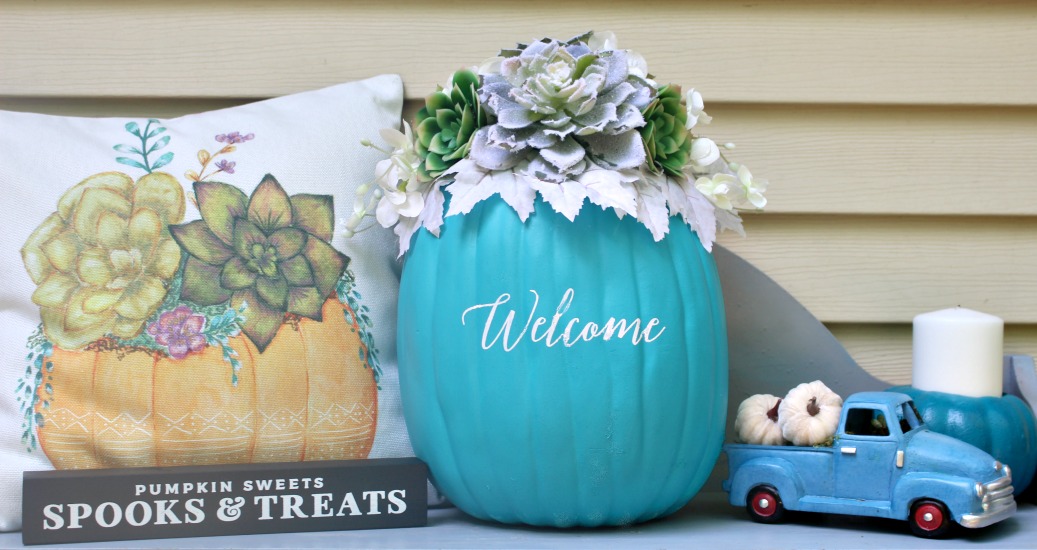 Teal Pumpkin Project succulent pumpkin on porch with pillow and small truck
