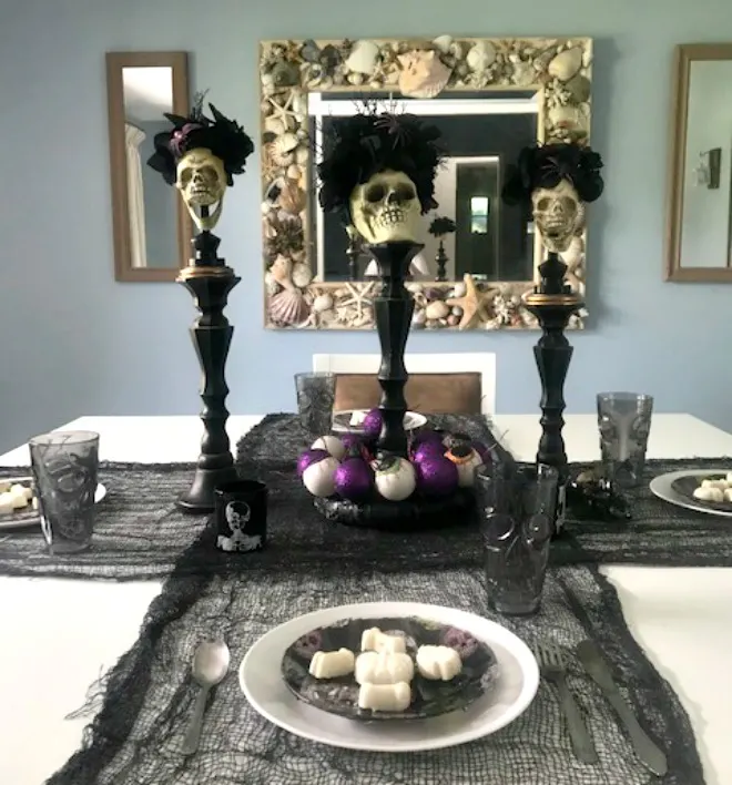 halloween table with sugar skulls day of the dead theme