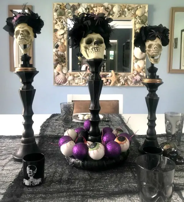 set of three skull candle holders