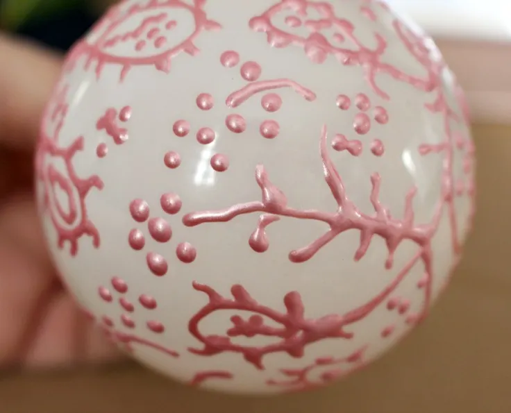 hand painted christmas ornament with pink metallic paint