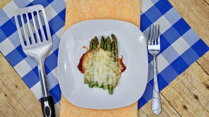 cheesy asparagus on plate