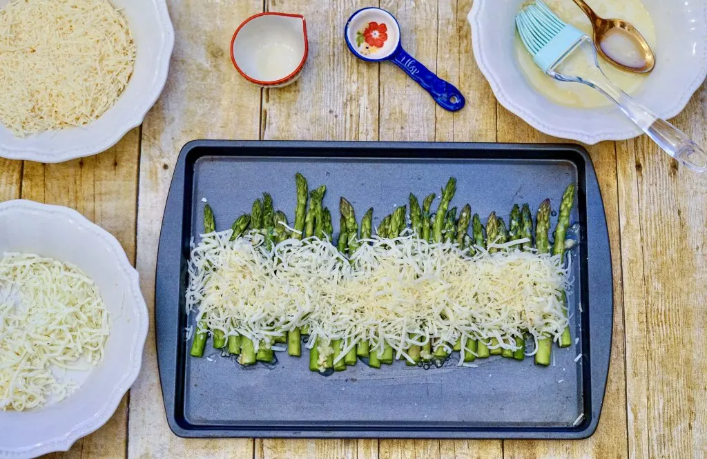asparagus with cheese on pan