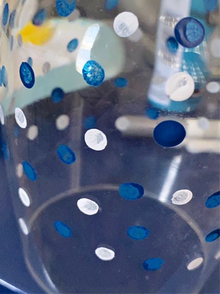 blue and white polka dots on glass