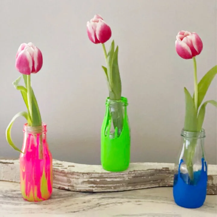 starbucks bottles used as vases with tulips
