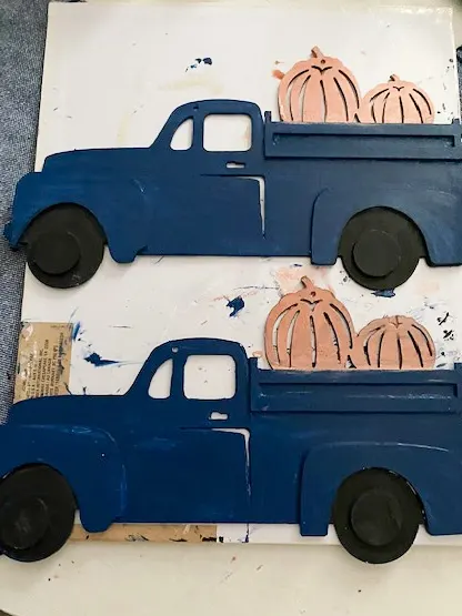 2 painted blue trucks