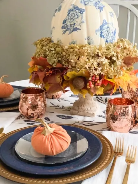 close up fall tablescape blue and orange