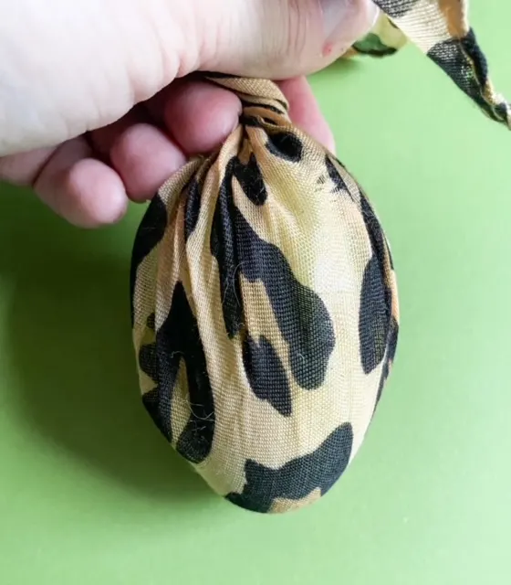 leopard fabric wrapped around plastic egg