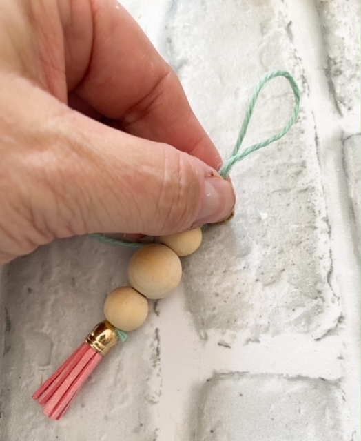 tying floss on ornament