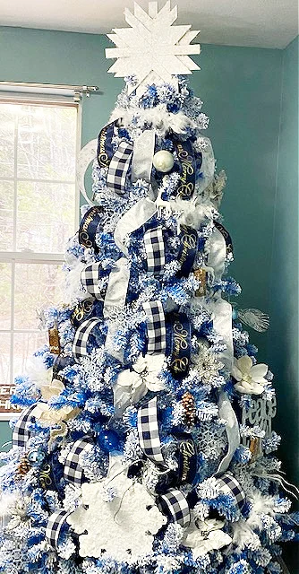 full view blue flocked Christmas tree