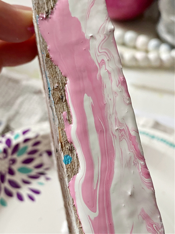 pink and white paint on wood b