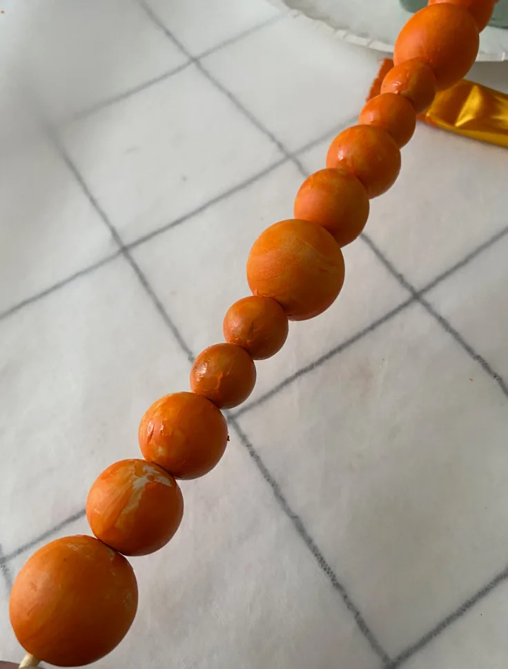 orange beads on skewar