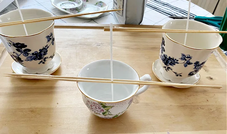 bamboo skewers and candle wicks on teacups