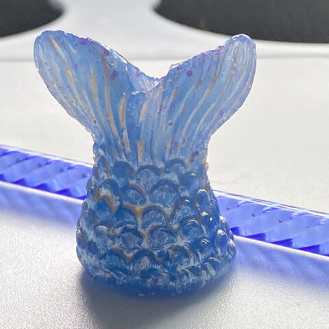 close up of mermaid resin straw topper