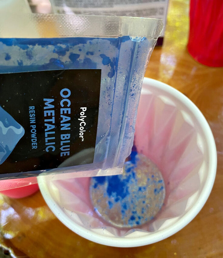pouring blue tint into resin