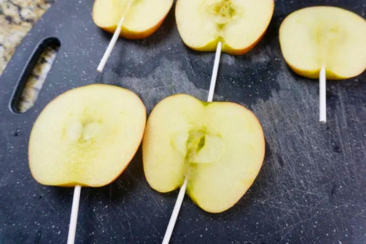sliced apples on pop sticks