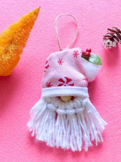 gnome Christmas ornaments on pink background