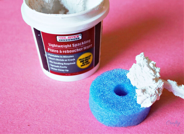 adding spackle to donut ornament