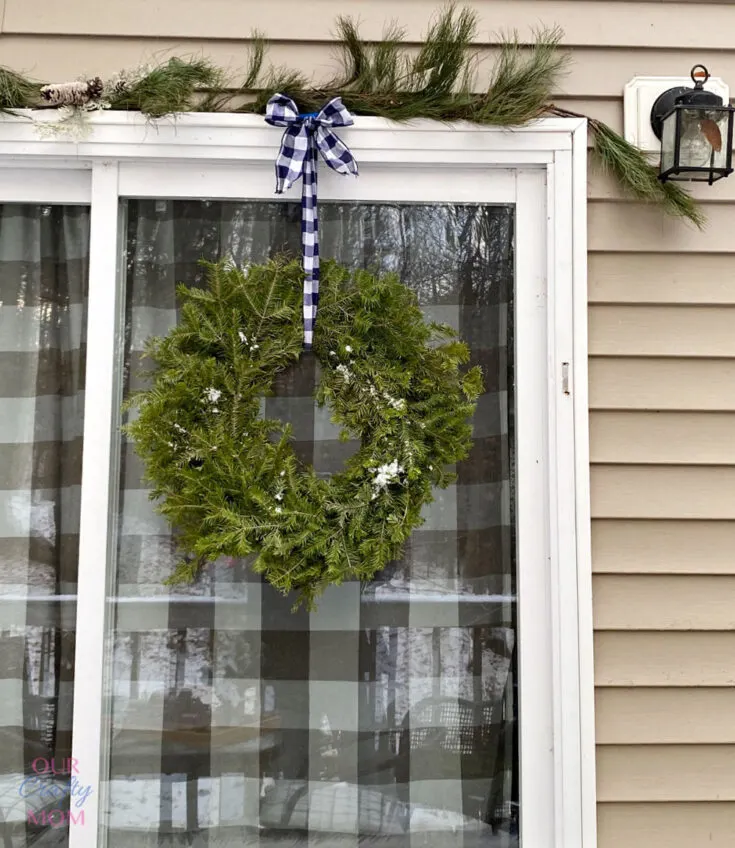 fresh pine wreath on sliding glass door