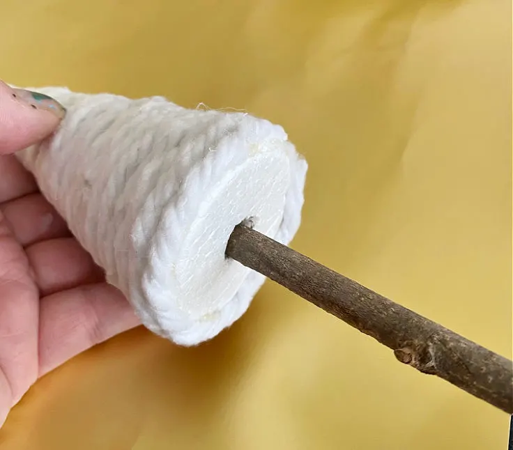 placing stick in foam