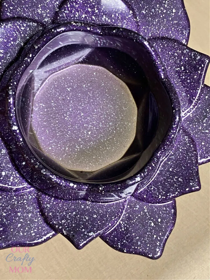 close up of tea light candle holder with resin