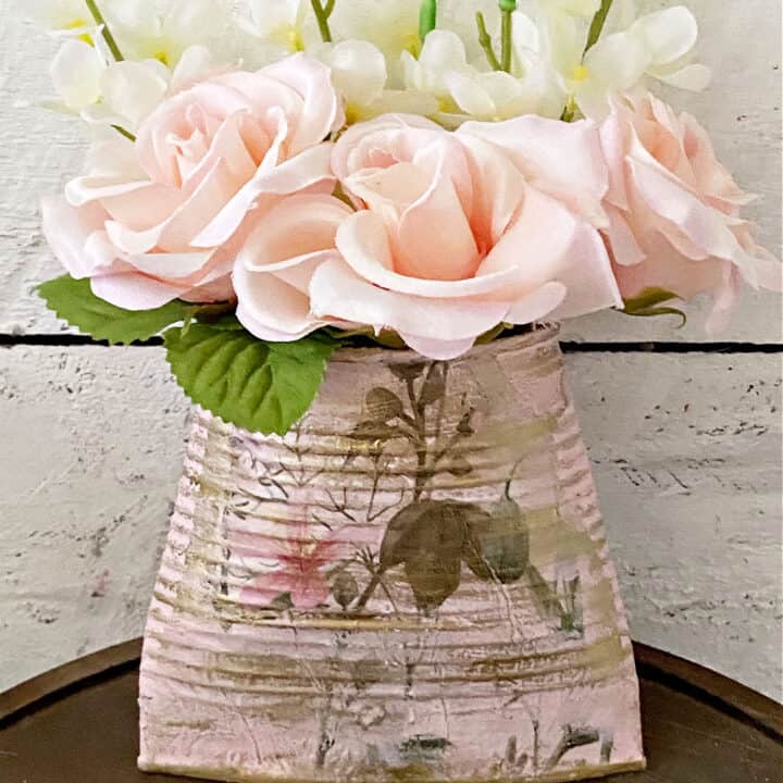 tin can wall pocket planter with pink flowers