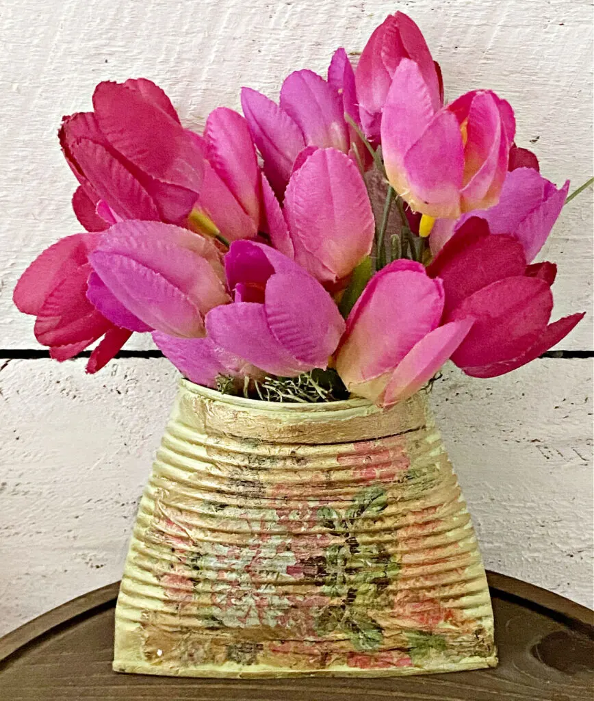 tin can wall planter with flowers