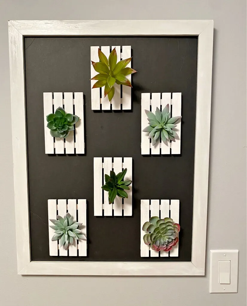 plant wall frame hanging in entryway