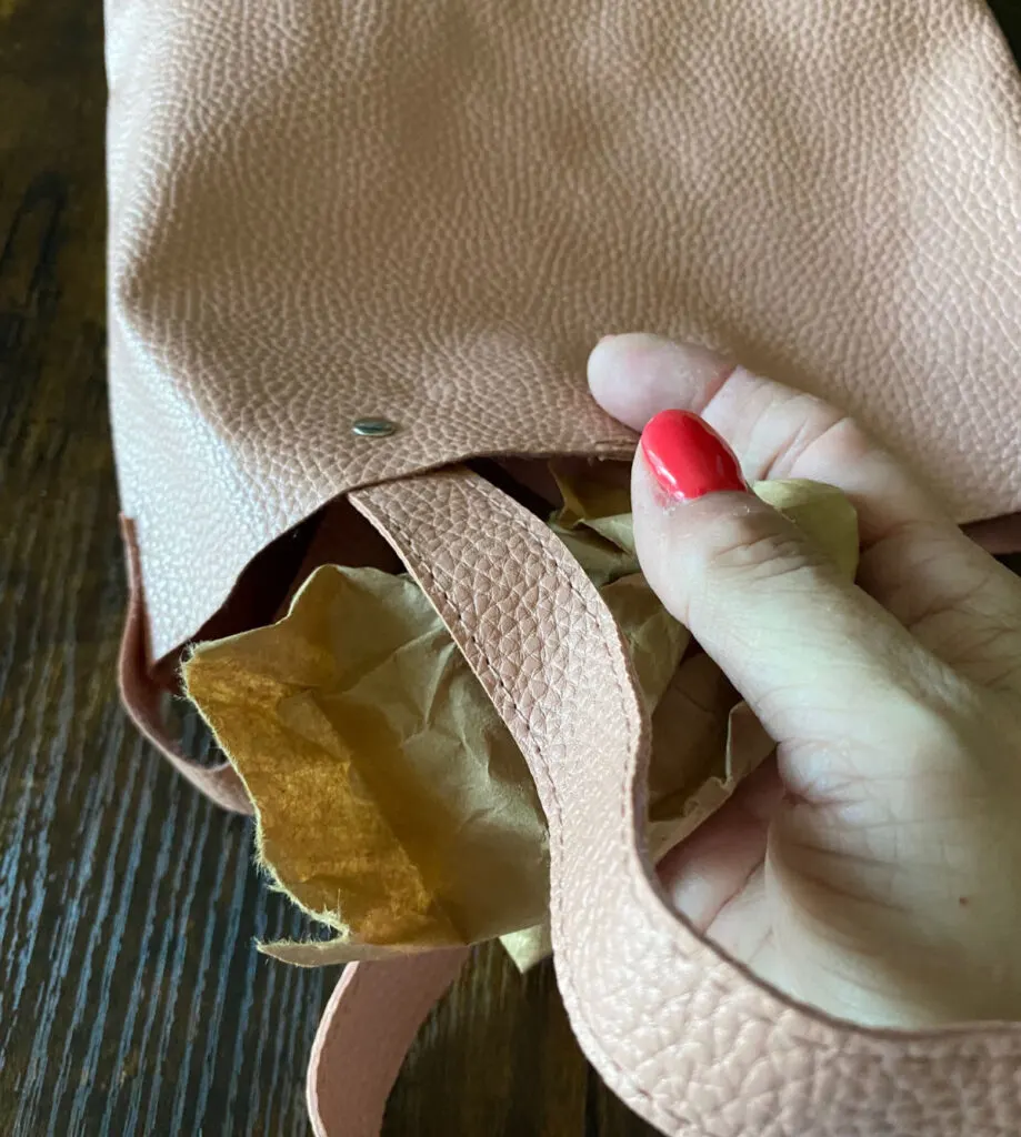 adding packing paper to tote bag