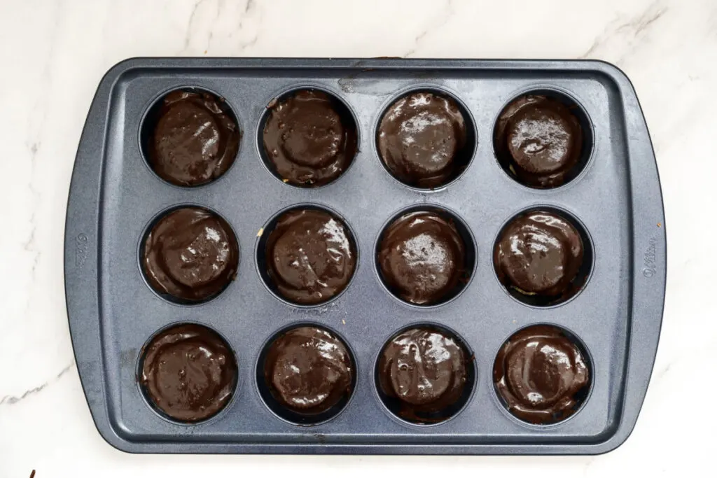 brownie mix on top of peanut butter cups in pan