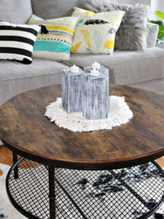 wooden candle holders on coffee table
