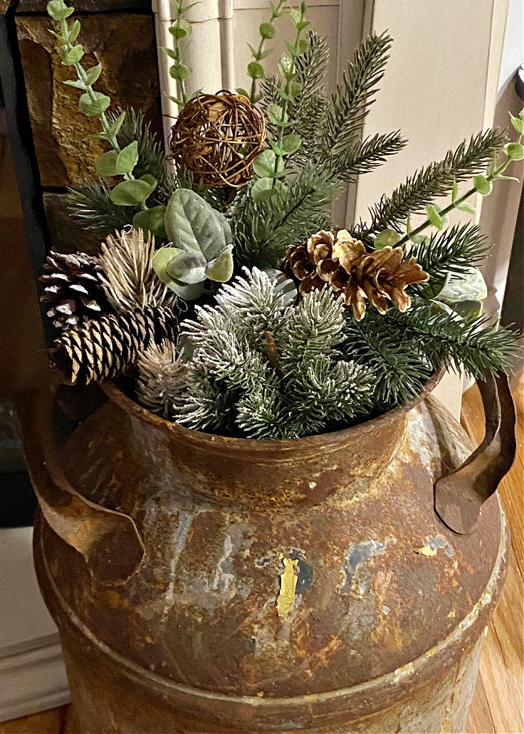 rustic milk can with pine greenery