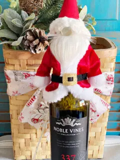 santa gnome wine bottle topper on bottle of wine