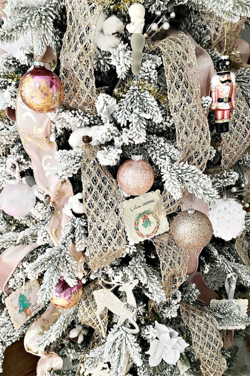 Elegant Pink & Gold Christmas Tree Decorations on a Flocked Tree