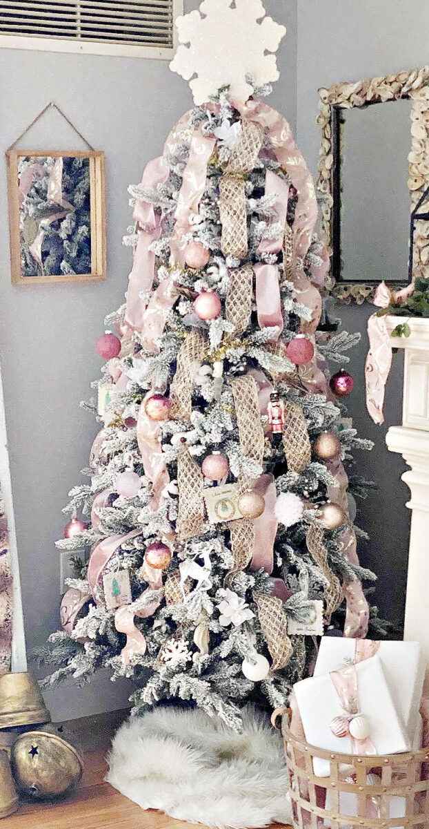 Elegant Pink & Gold Christmas Tree Decorations on a Flocked Tree