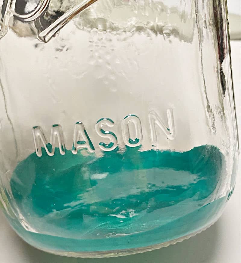 mixed paint in mason jar