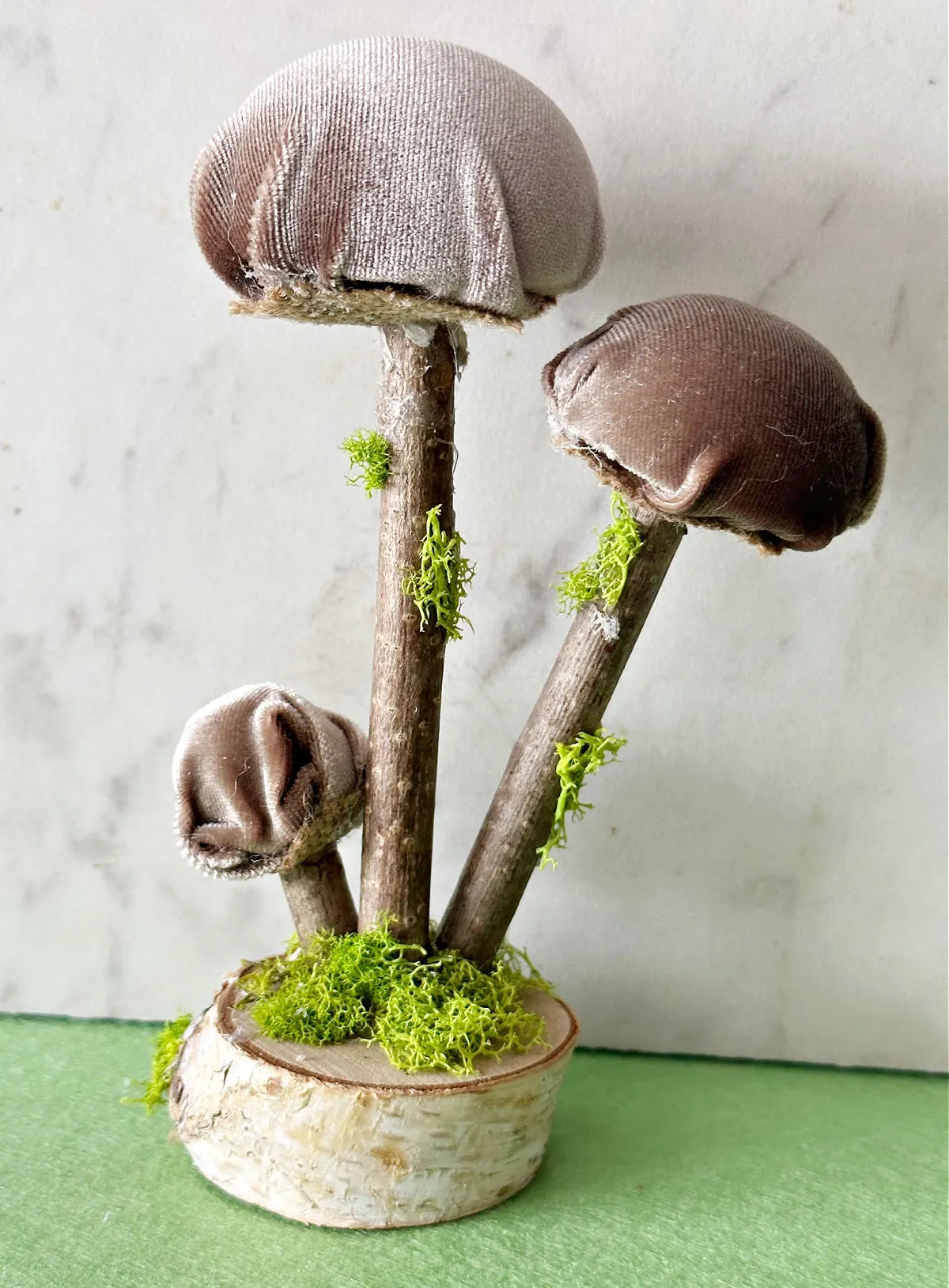 diy velvet mushroom craft on green background