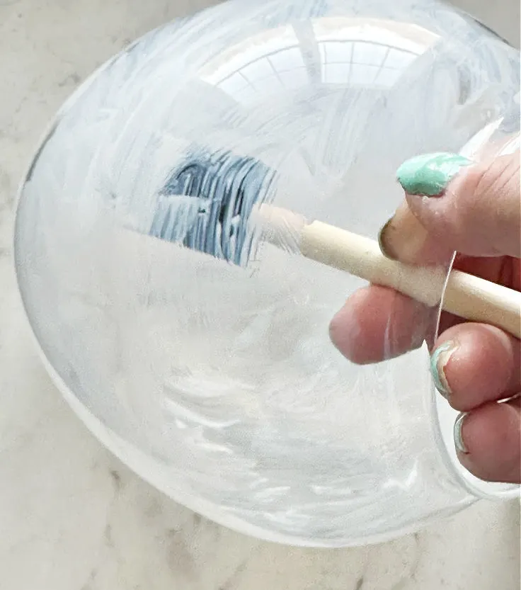 using foam brush to cover glass cloche