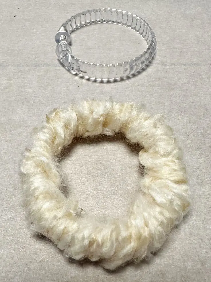 curtain ring wrapped with yarn