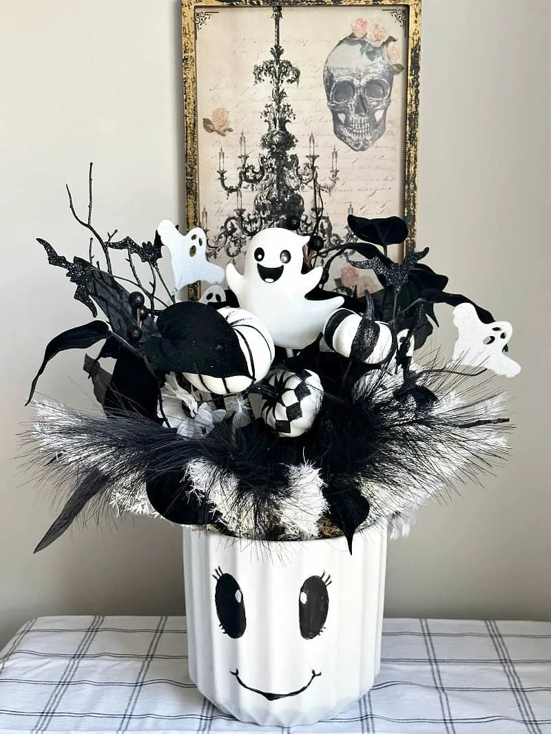 Halloween centerpiece on table with spooky wall decor