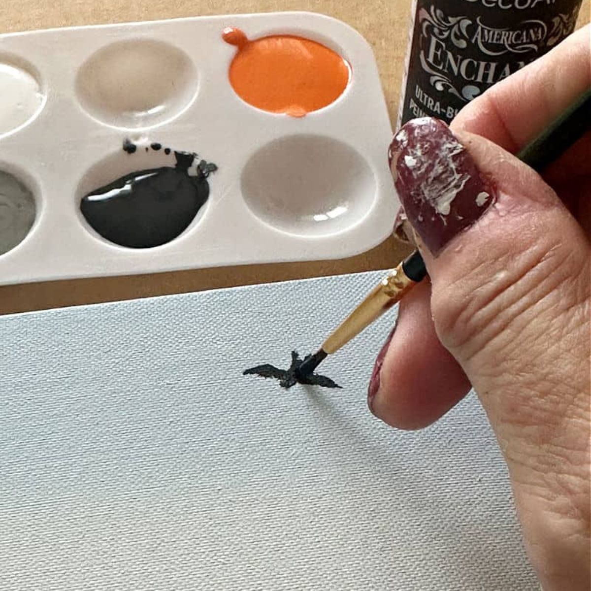 painting a bat on a canvas