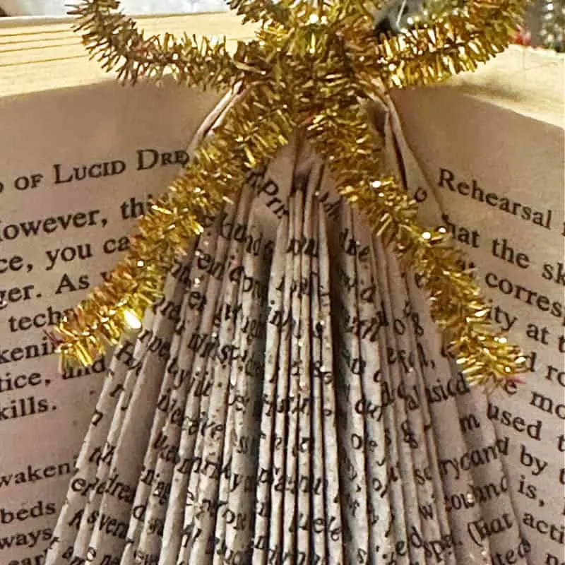 adding glitter to folded book art