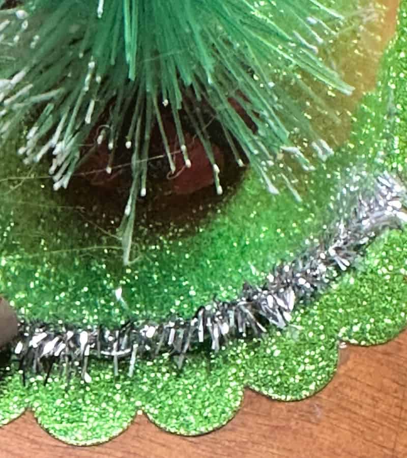 adding dabs of glue to ornament